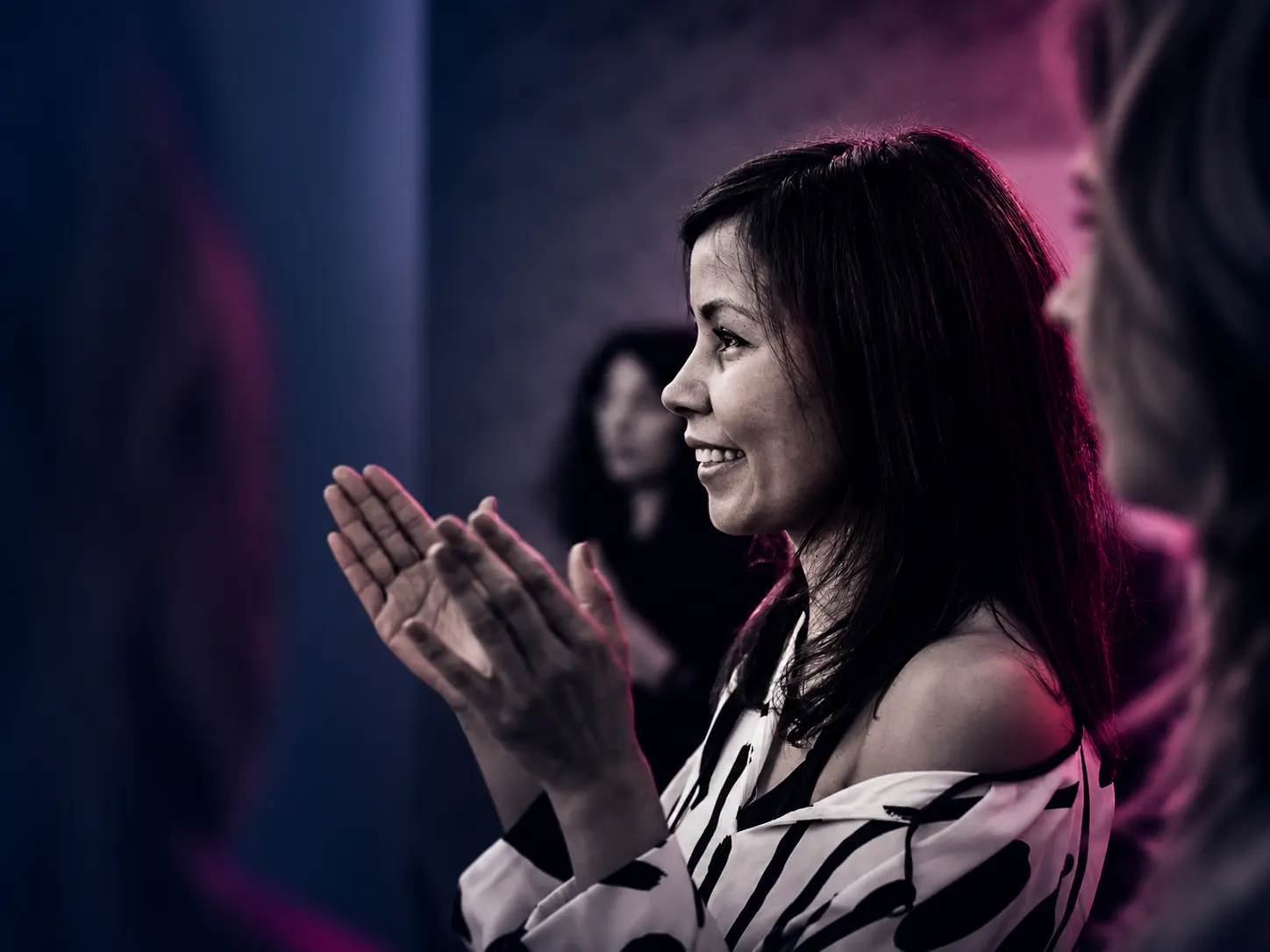Cinematic Applause in Magenta Light